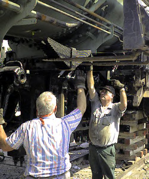 Installing the springs under the boiler.