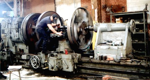 Driver being turned on a BIG lathe.